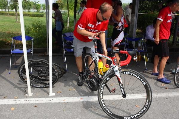 Final adjustments to a bike in the Austrian team cabin