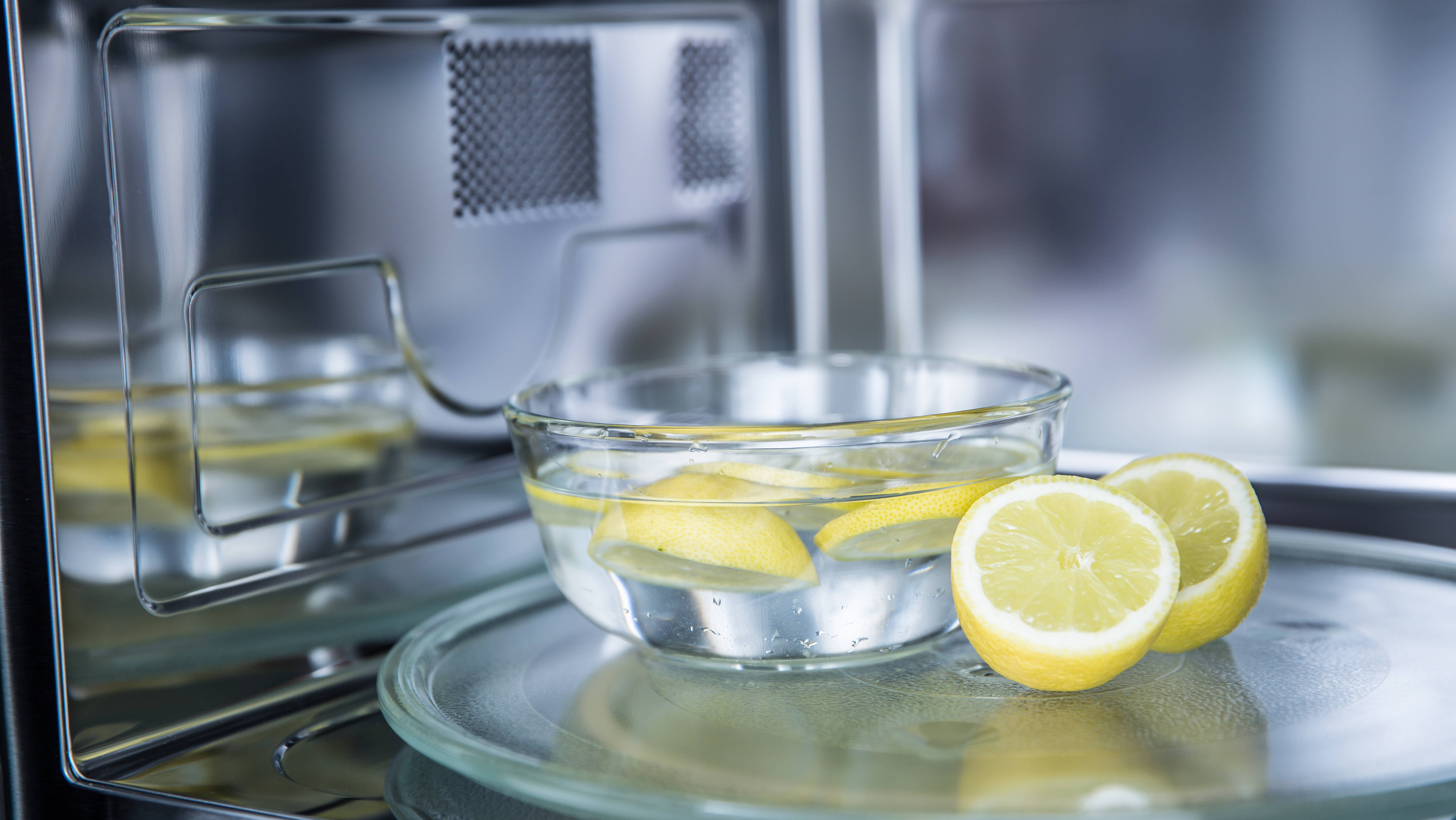 Slices of lemon in water inside a microwave