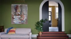 dark living room with moss green walls