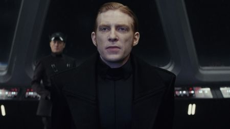 General Hux (Domhnall Gleeson) becomes tense as he receives a transmission from Supreme Leader Snoke in Star Wars: The Last Jedi.