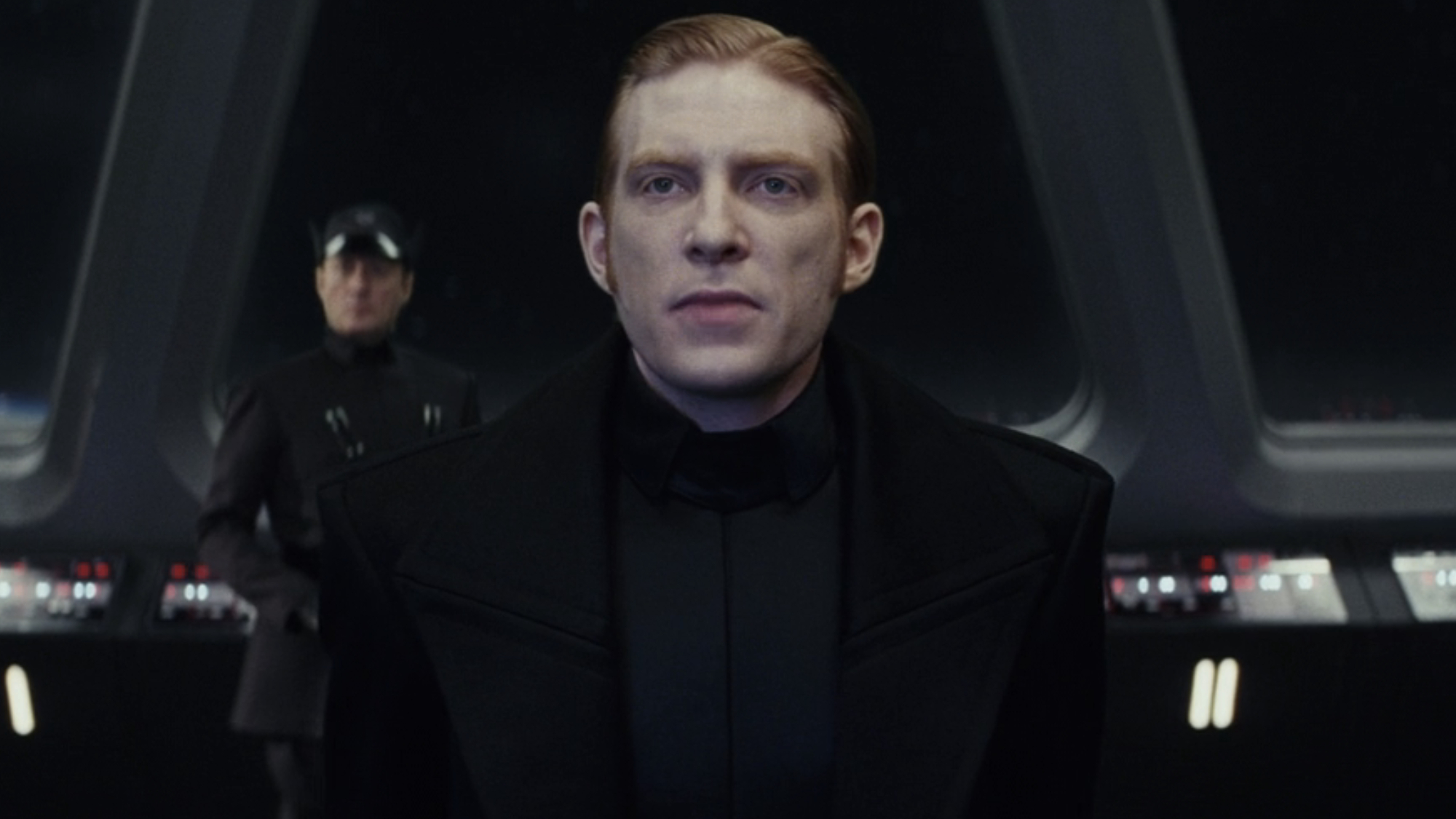 General Hux (Domhnall Gleeson) becomes tense as he receives a transmission from Supreme Leader Snoke in Star Wars: The Last Jedi.
