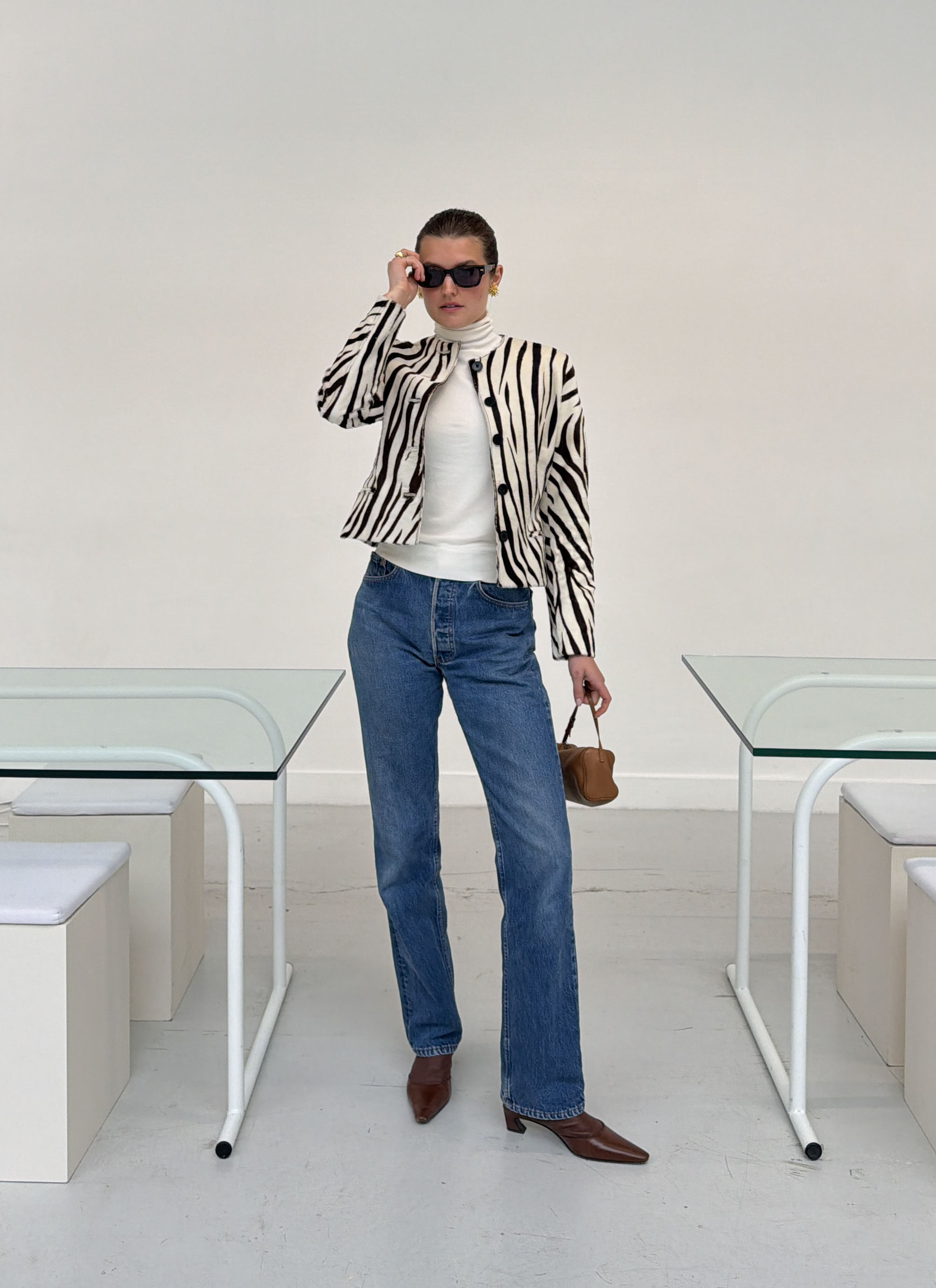 Woman in zebra jacket and jeans
