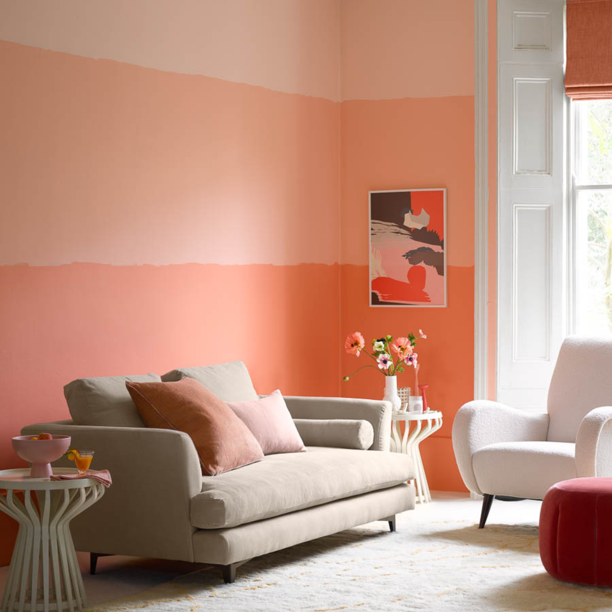 A living room painted with large horizontal peach stripes.