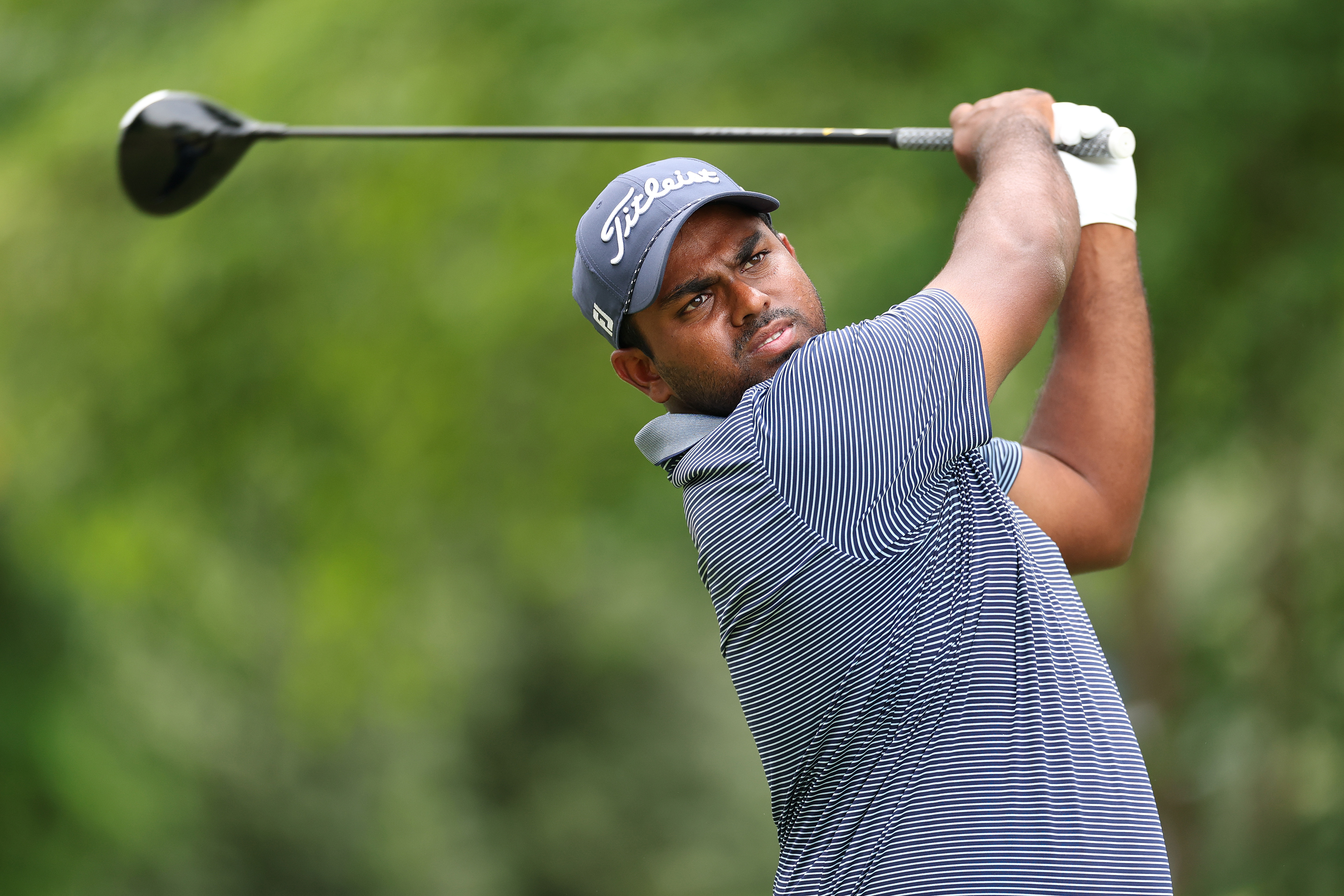 Rayhan Thomas hits a driver off the tee