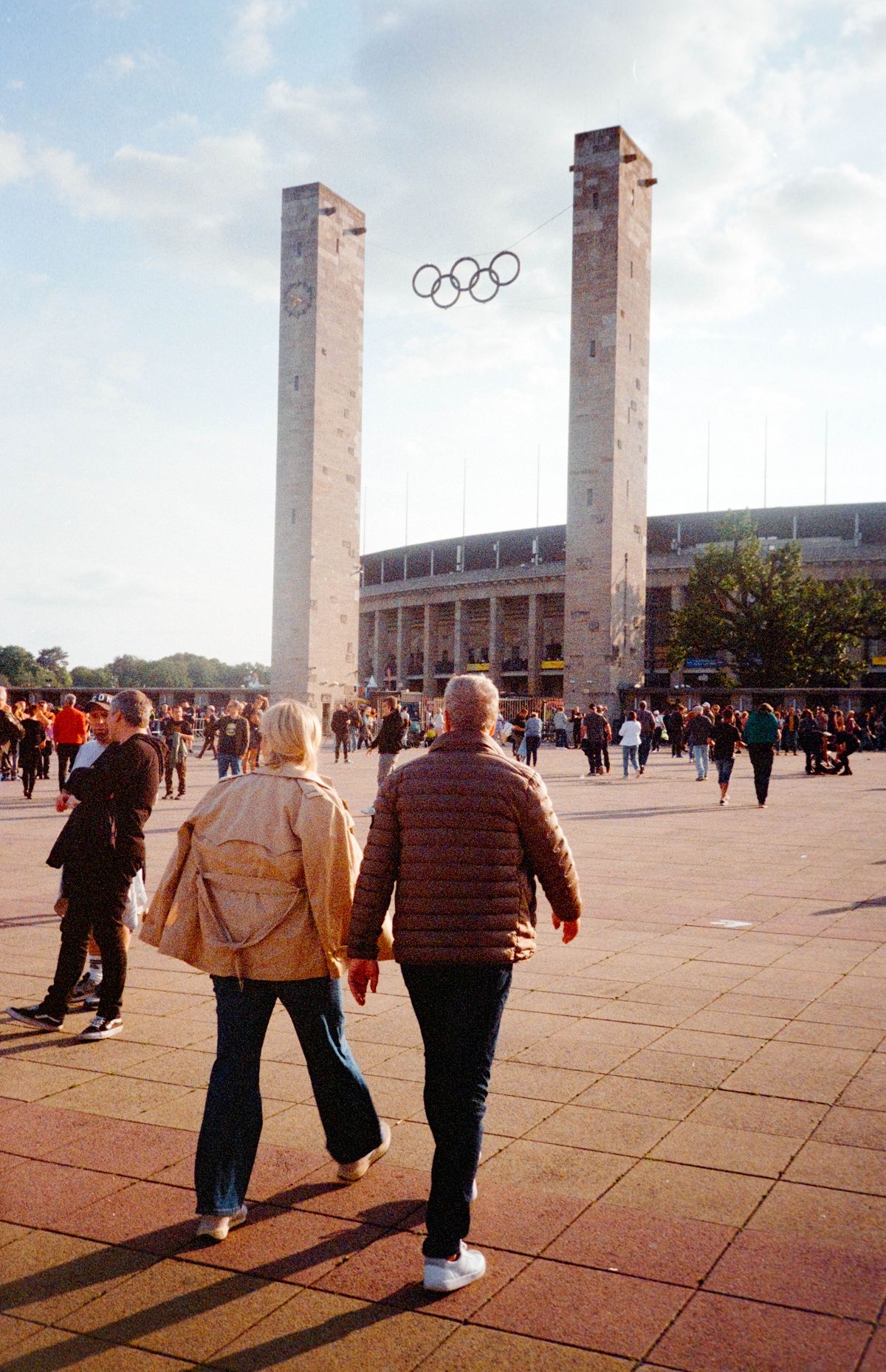 Scanned and digitized film image, using Valoi Easy 35 Pro V2 and Negative Lab Pro Lightroom plugin. Image shows two people walking towards the Berlin Olympic Stadium
