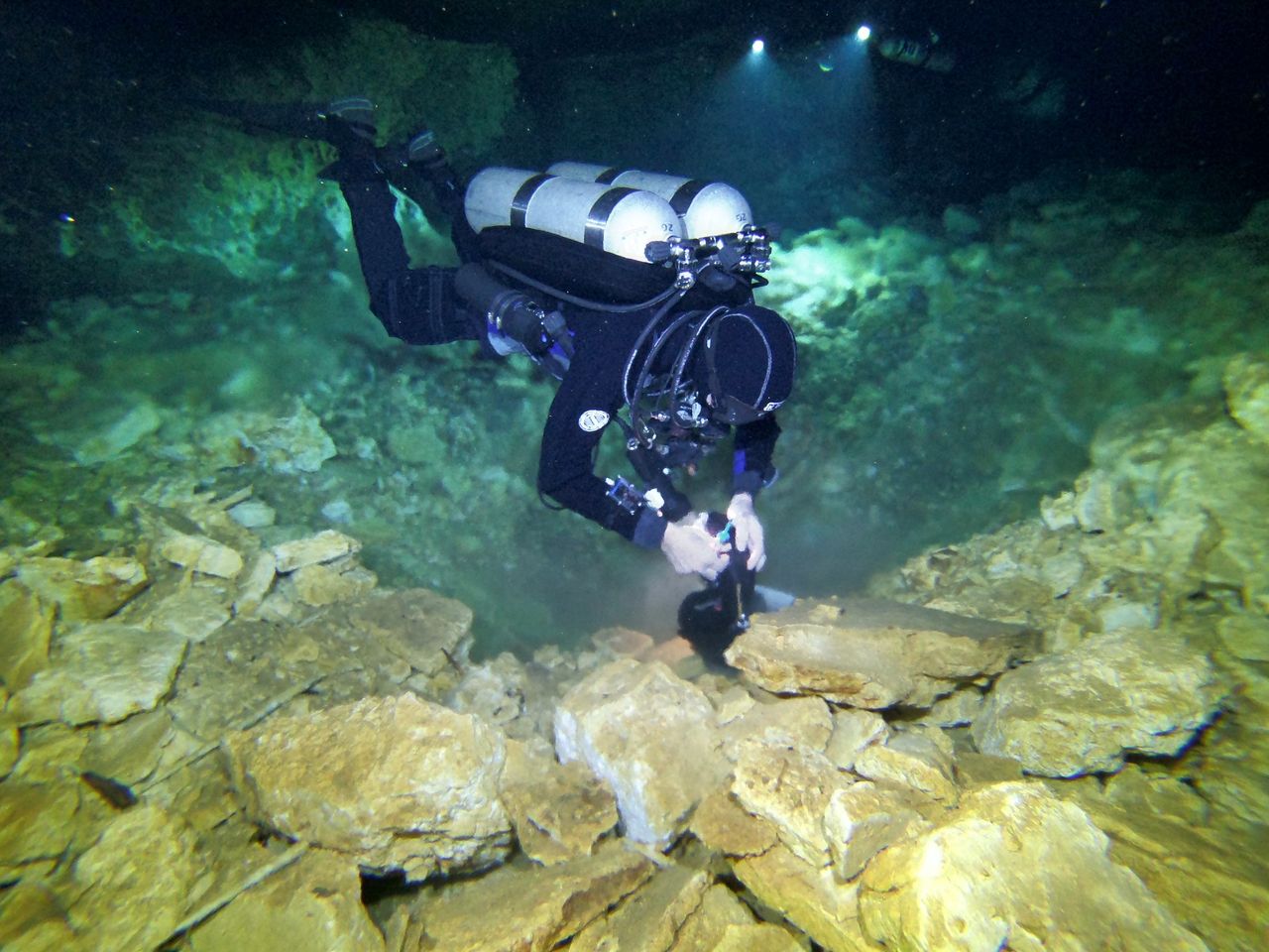 A diver looks at an ochre pit, which attracted Indigenous people who mined it at the end of the last ice age.