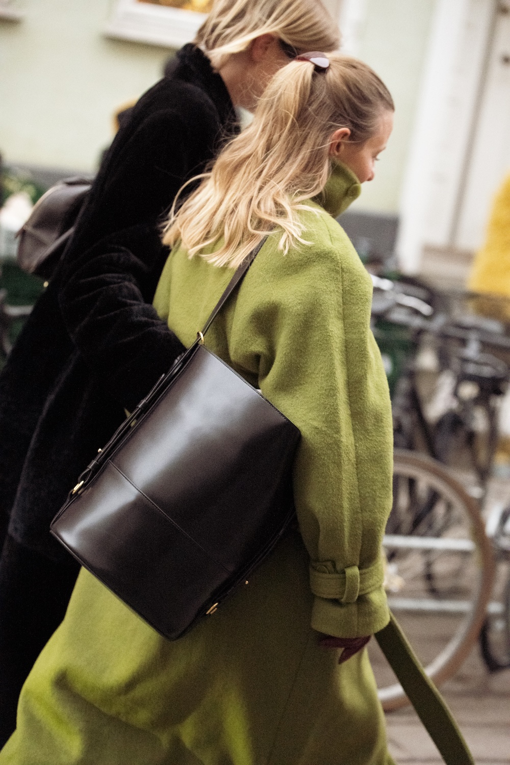 models at copenhagen fashion week wearing fur coats and colorful coats