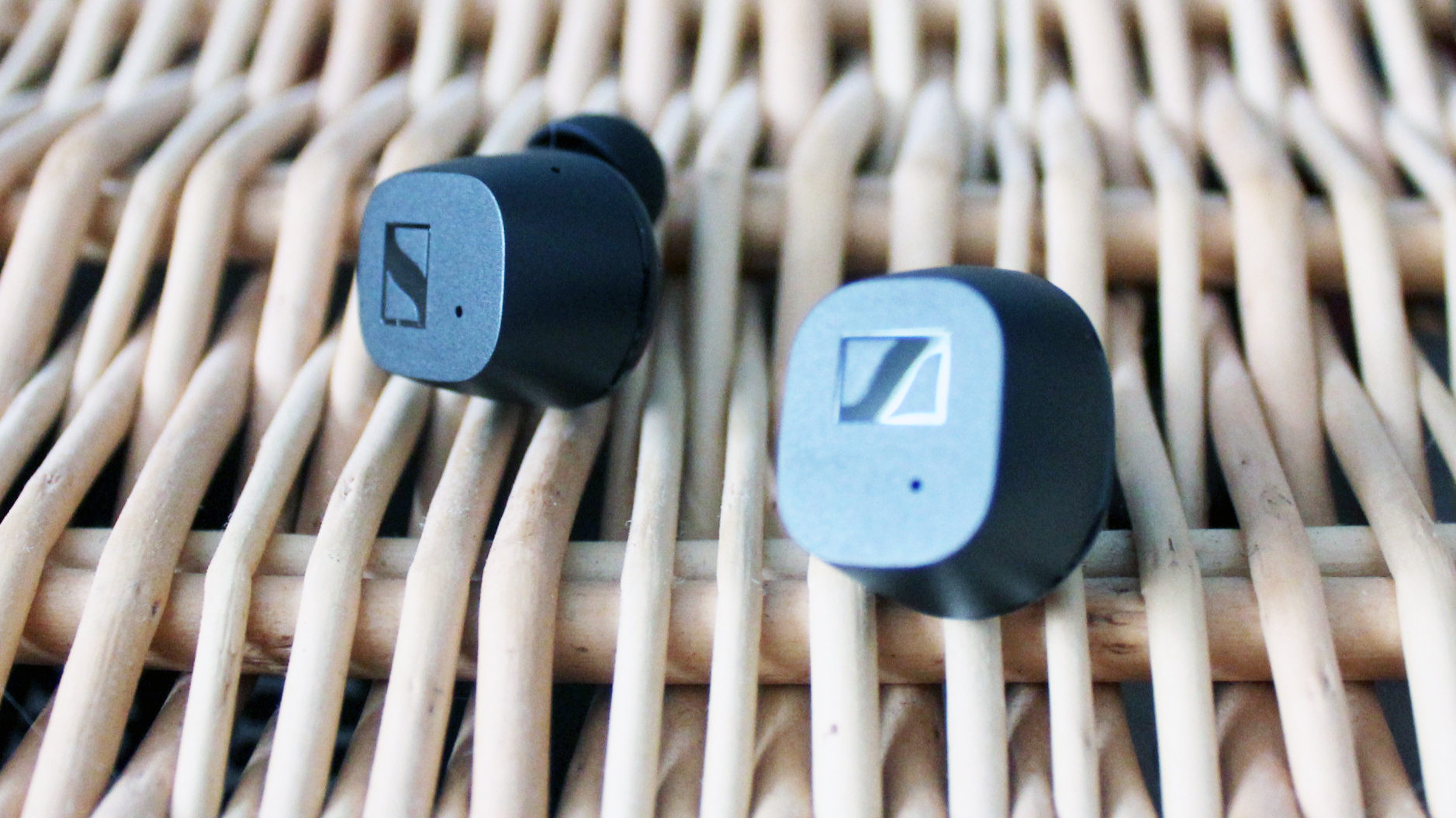 sennheiser cx true wireless earbuds on a wicker background