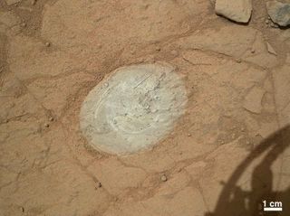 Mars Rover Curiosity Brushes Rock