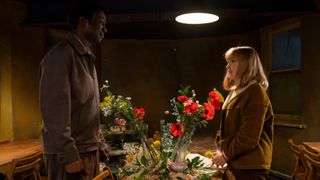 Rosalind and Cyril looking lovingly at one another over a flower arrangement in Call the Midwife season 14 ep 2