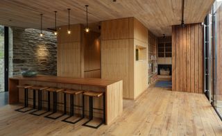 The internal timber skin both dispels the need for plasterboard and warmly envelops the interior