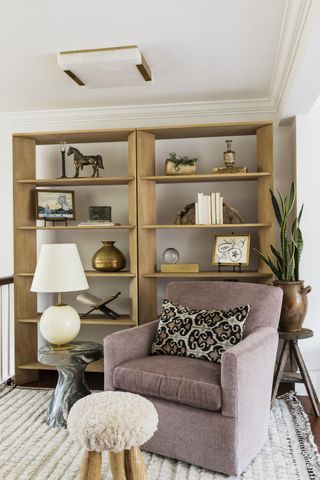 living room with wooden bookcase filled with books and objects