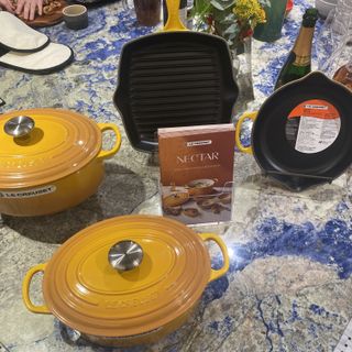 Le Creuset cast iron cookware on display during a demo