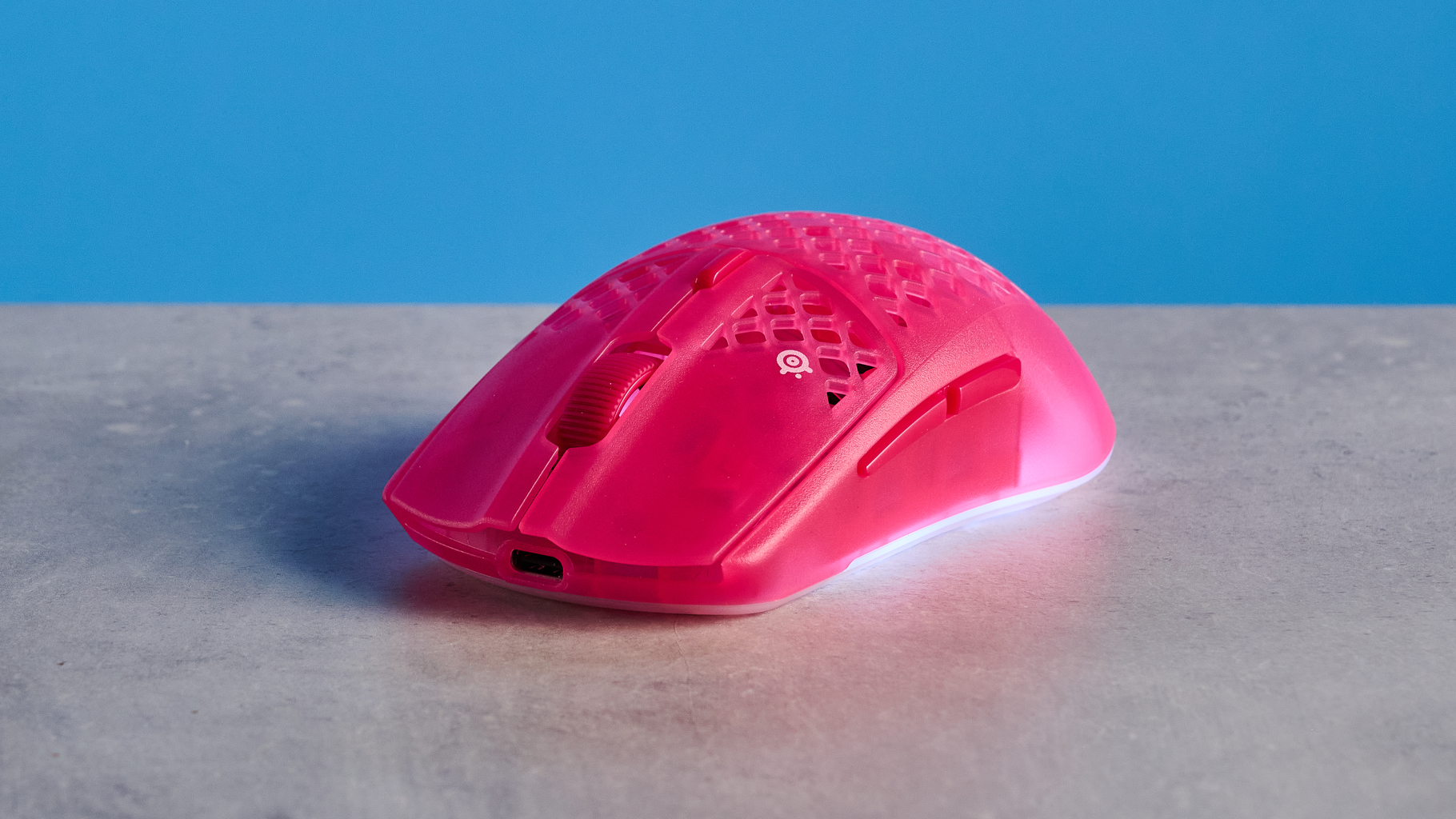 A magenta SteelSeries Aerox 3 Wireless Gen 2 wireless mouse for gaming