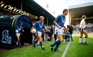 Mo Johnston (holding the ball) comes out on to the pitch ahead of his debut for Rangers in a friendly against Tottenham in 1989.