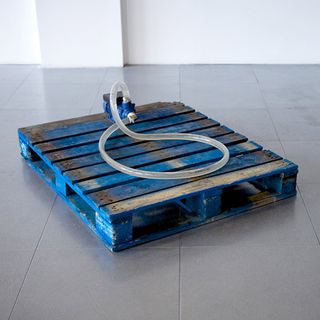 Close circuit pump on a blue crate