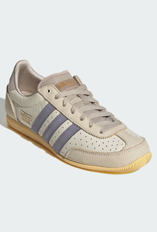 A picture of an Adidas Japan trainer, a style suitable to wear with a dress.