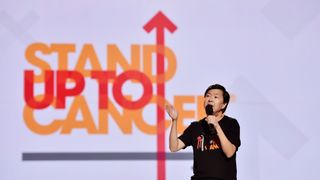 Ken Jeong on stage at Stand Up To Cancer telecast
