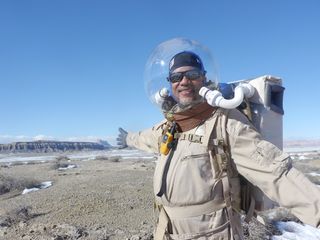 Crew 133 executive officer Gordon Gartrelle during a "Marswalk" near Utah's Mars Desert Research Station. Gartrelle was seeking evidence of ancient hydrothermal vents.