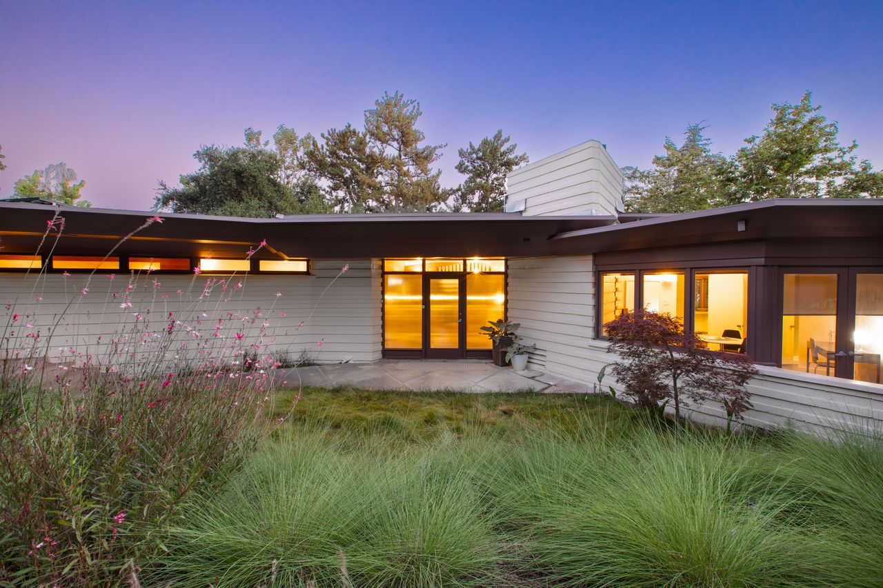 Exterior shot of a bungalow at dusk