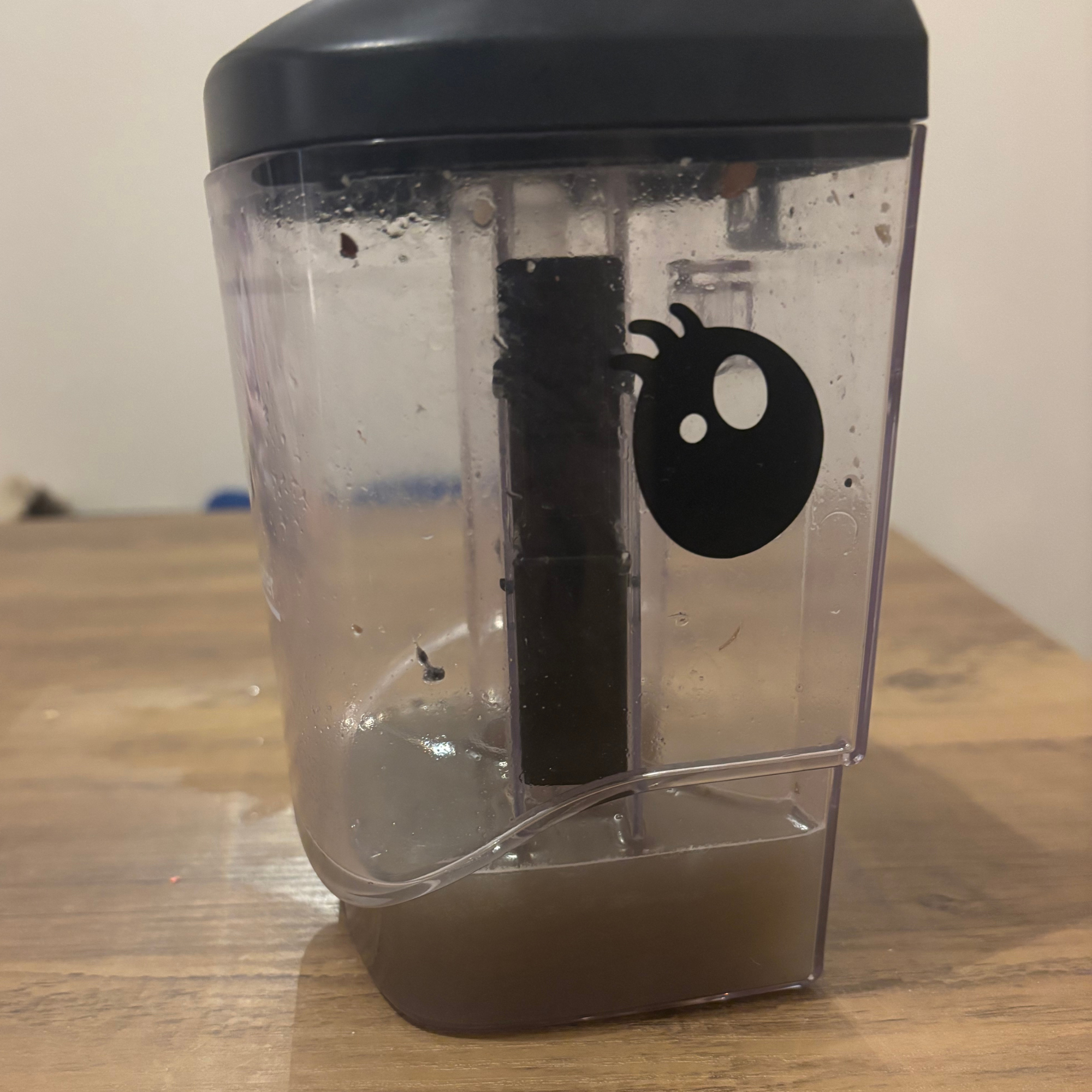 Gtech Koala Spot Cleaner dirty water tank with murky, grey water 