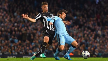 Ryan Taylor of Newcastle United and David Silva of Manchester City 