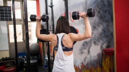 Person exercising with dumbbells
