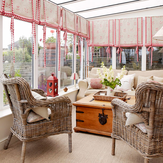 room with glass window and cane chair