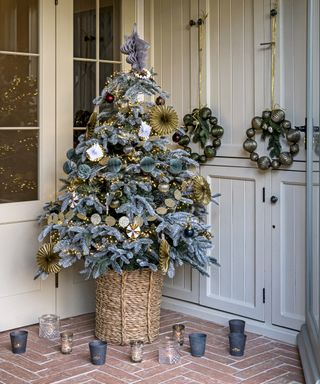 Christmas tree with paper decorations and pale blue toppers