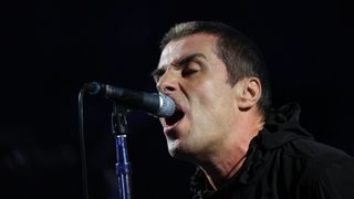 Liam Gallagher singing into a mic