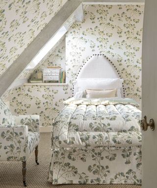 Small guest bedroom with floral wallpaper