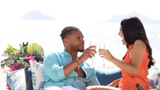 Leo and Kassy toasting glasses in Love Island USA season 5