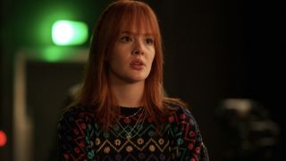 Madeleine Power in a patterned jumper as Claudia in Douglas is Cancelled.