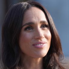 A headshot of meghan markle smiling