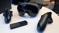 The Steam Frame VR headset, controllers, and packed-in wireless dongle