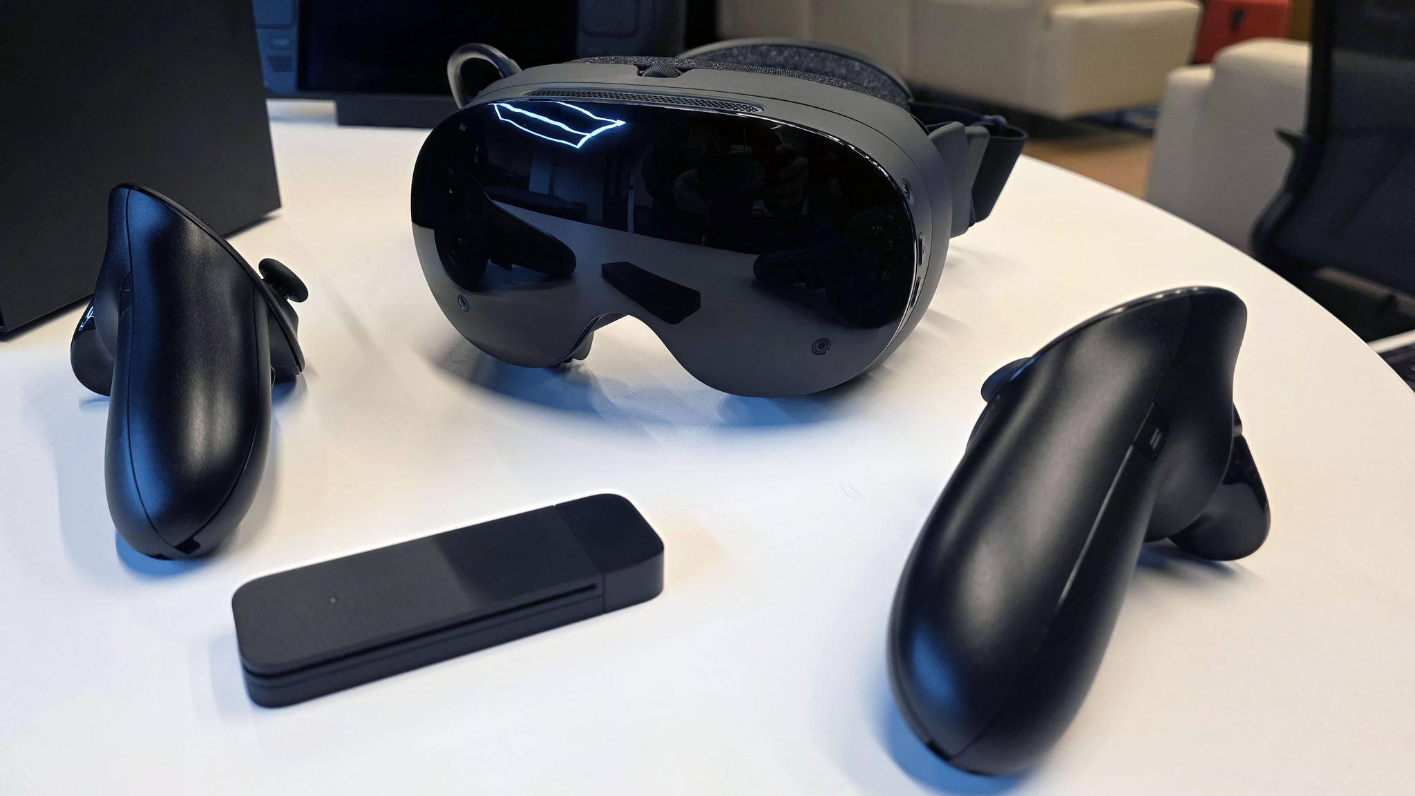 The Steam Frame VR headset, controllers, and packed-in wireless dongle