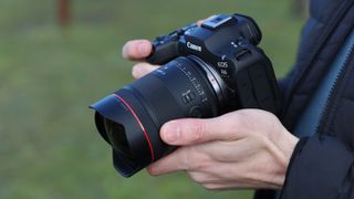 Canon EOS R6 Mark III camera with Canon RF 14mm f/1.4L VCM lens attached held in a pair of hands