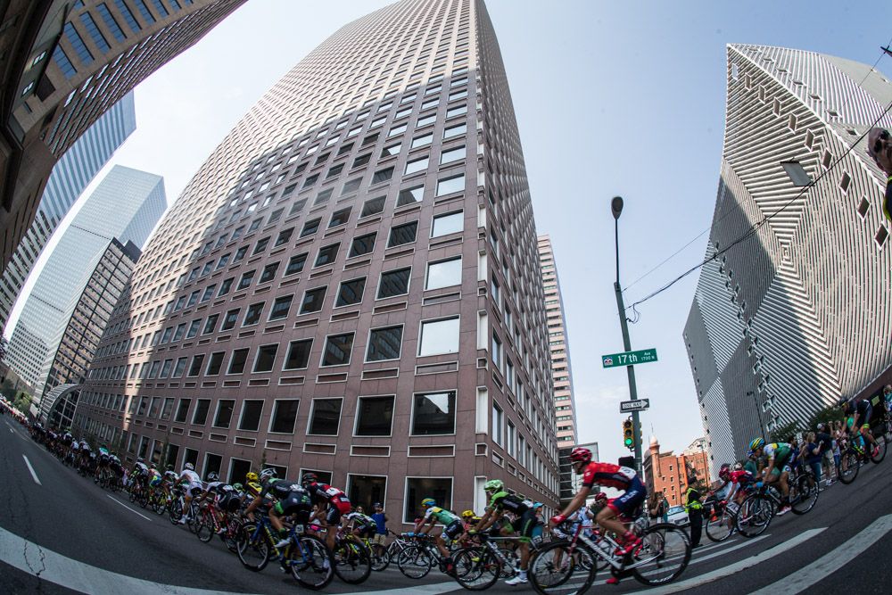 The peloton rides amongst the Denver high rises