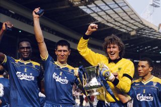 Wimbledon's Eric Young, Lawrie Sanchez, Dave Beasant and Terry Phelan celebrate with the FA Cup after beating Liverpool in the 1988 final
