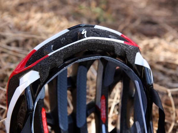 The brow pad is held in place by the retention system anchors but is otherwise suspended in space. Lots of room in between the pad and the forward edge of the shell means more air can come in.