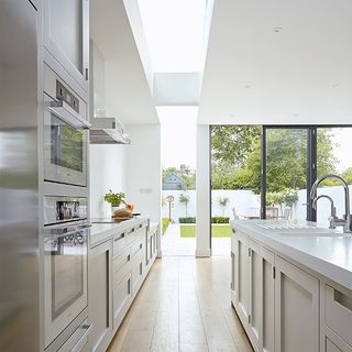 kitchen with wooden floor and white walls