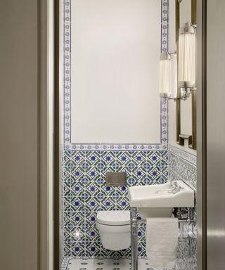 small powder room with decorative tiles