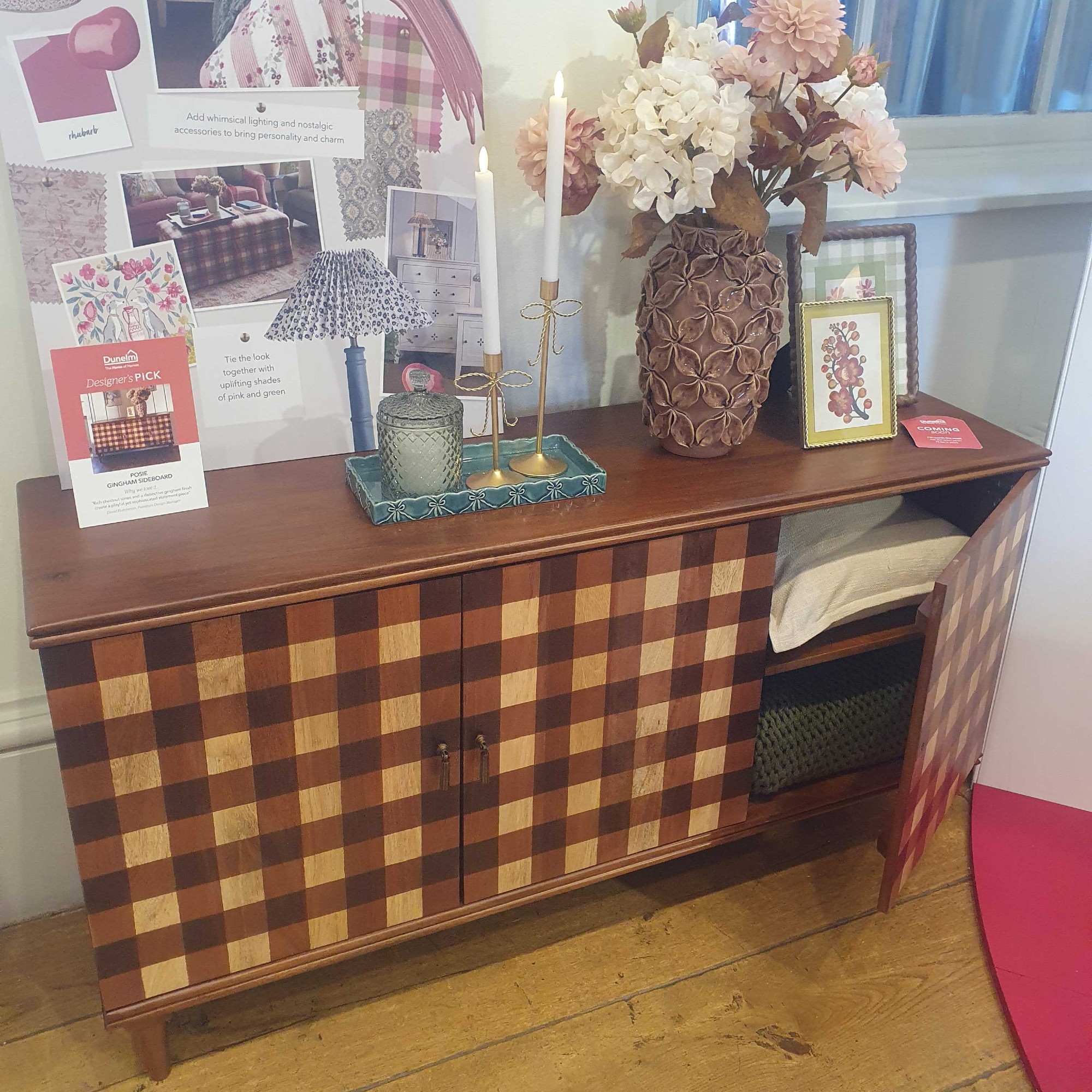 The Dunelm Posie gingham sideboard with a vase of faux flowers on top at the brand's autumn/winter 2026 press preview