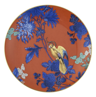 red plate with a parrot on it