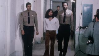 Charles Manson being taken into custody in Making Manson