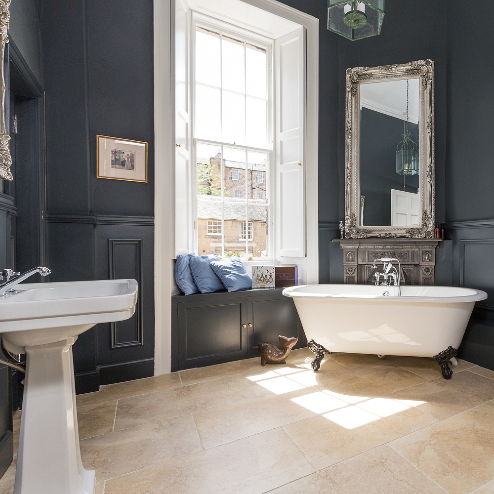 bathroom with white bathtub and wash basin