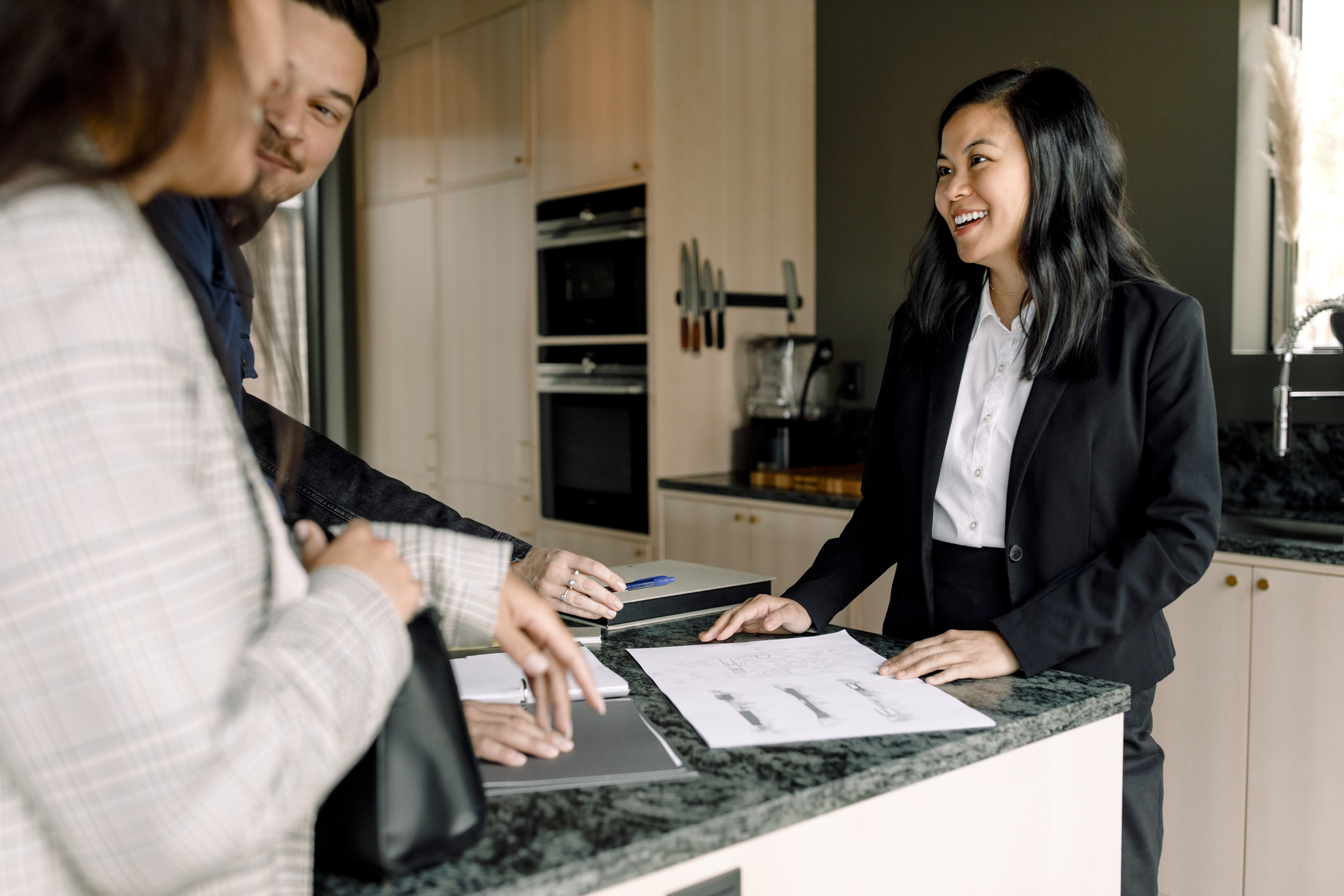 estate agent showing people round home