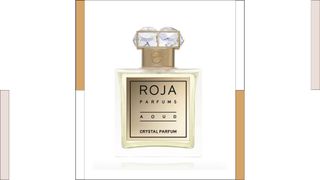 Roja Parfums Aoud Parfum with colored columns next to it