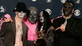 Slipknot holding their Grammy in 2006