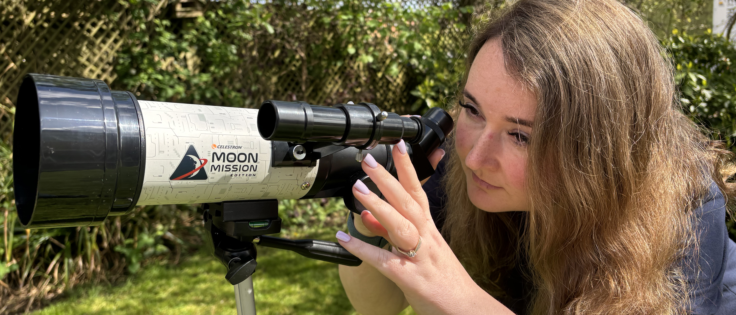 The author looking through a Celestron Moon Mission Travel-scope 70. 